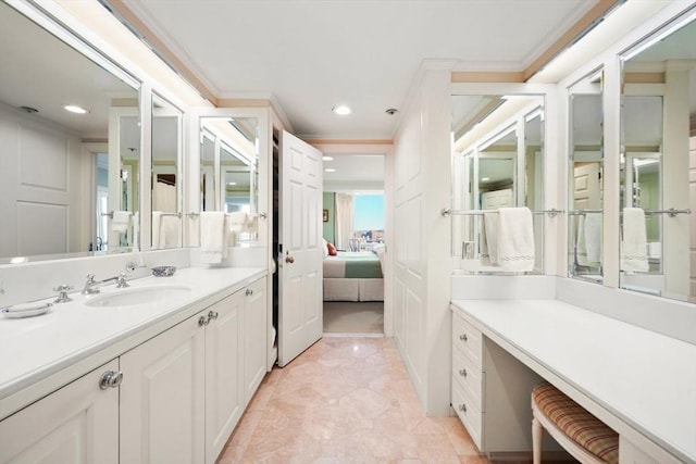 bathroom featuring vanity and crown molding