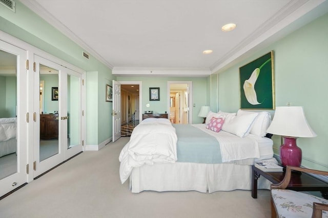 bedroom with light carpet, connected bathroom, crown molding, and french doors