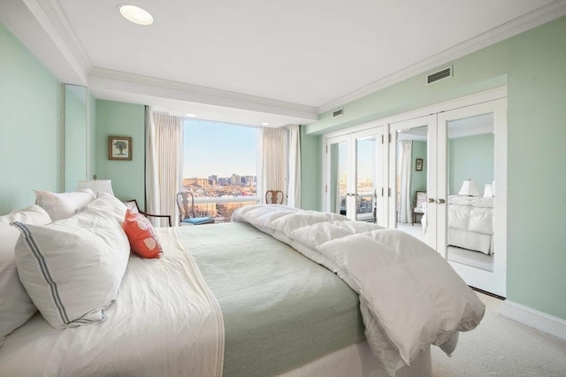 bedroom featuring carpet floors, access to outside, ornamental molding, and french doors