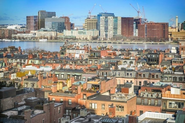 property's view of city with a water view