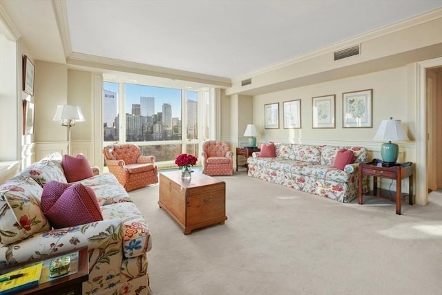 living room featuring ornamental molding and light carpet