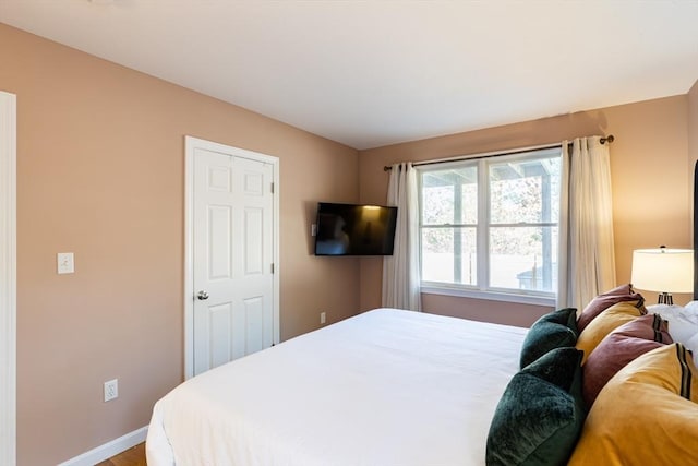 bedroom with hardwood / wood-style flooring