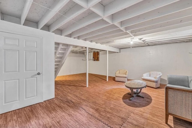 basement featuring hardwood / wood-style floors