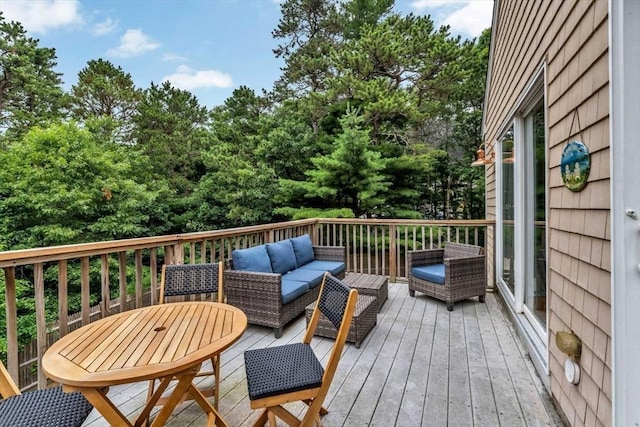 deck featuring outdoor lounge area