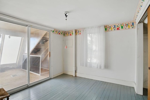 spare room with hardwood / wood-style floors