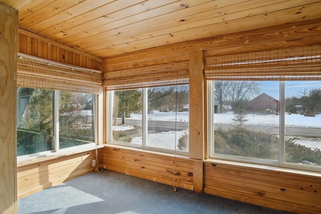 unfurnished sunroom with wooden ceiling