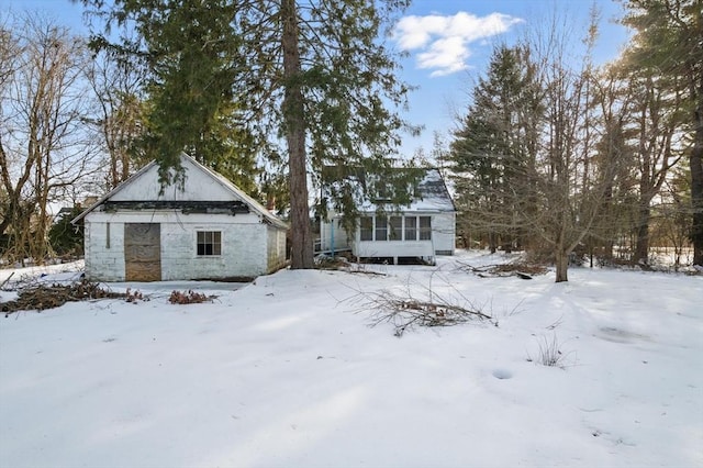 view of snow covered house