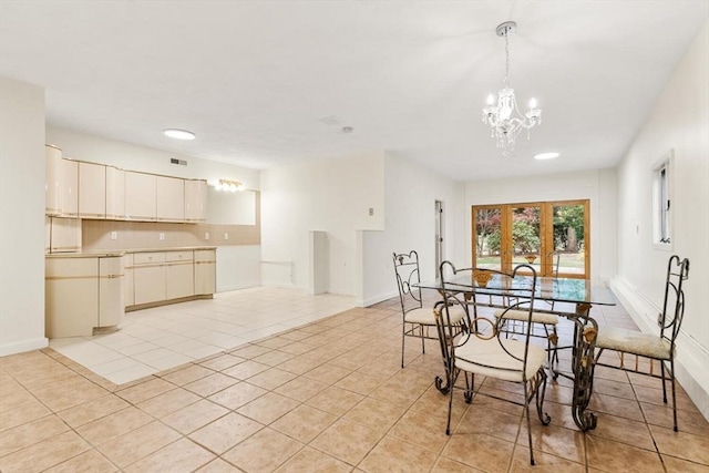 dining space with light tile patterned flooring, baseboards, a chandelier, and recessed lighting