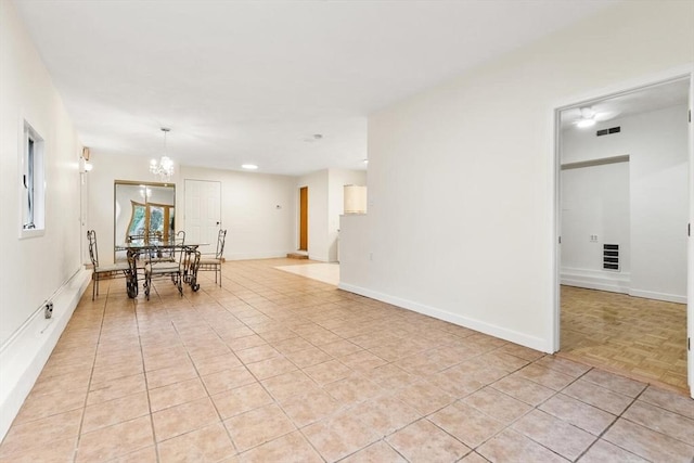 dining room with baseboards, a notable chandelier, and visible vents