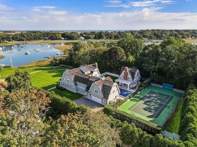 birds eye view of property with a water view