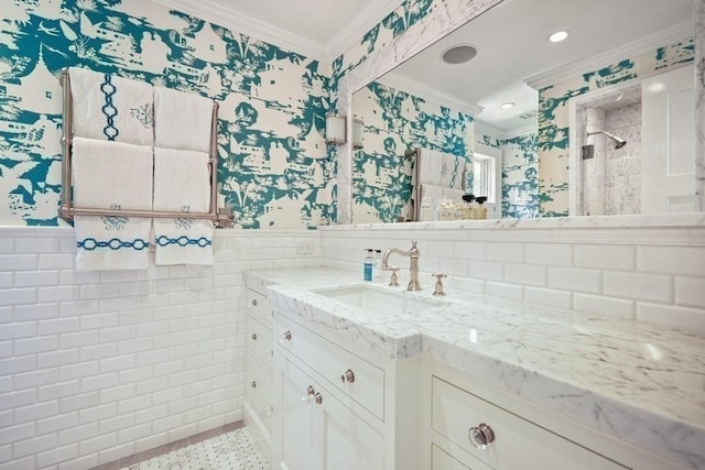 full bath featuring a wainscoted wall, wallpapered walls, and ornamental molding