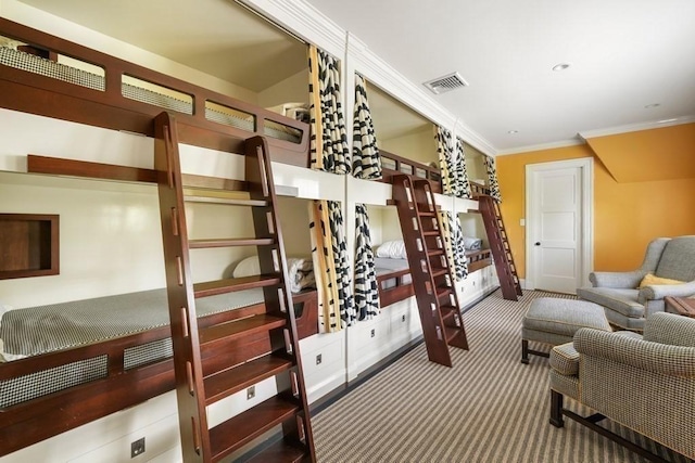 carpeted bedroom featuring recessed lighting, ornamental molding, and visible vents