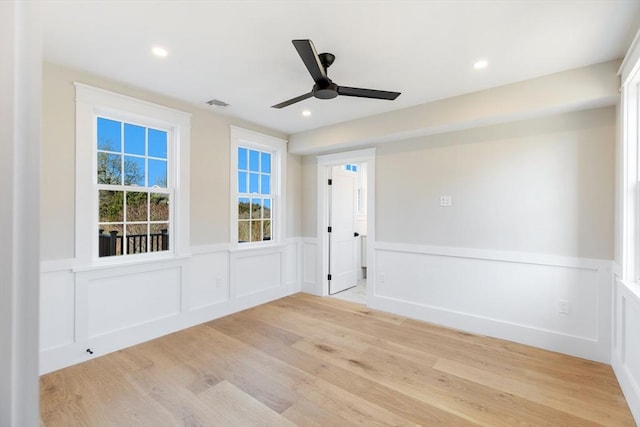 6 Mariner Way, Nantucket, MA 02564 - spare room featuring light wood finished floors, ceiling fan, a wainscoted wall, and a decorative wall
