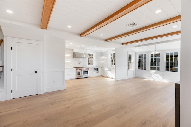 6 Mariner Way, Nantucket, MA 02564 - unfurnished living room featuring visible vents, beamed ceiling, recessed lighting, light wood finished floors, and a notable chandelier