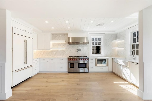 6 Mariner Way, Nantucket, MA 02564 - kitchen featuring visible vents, range hood, a sink, premium appliances, and recessed lighting