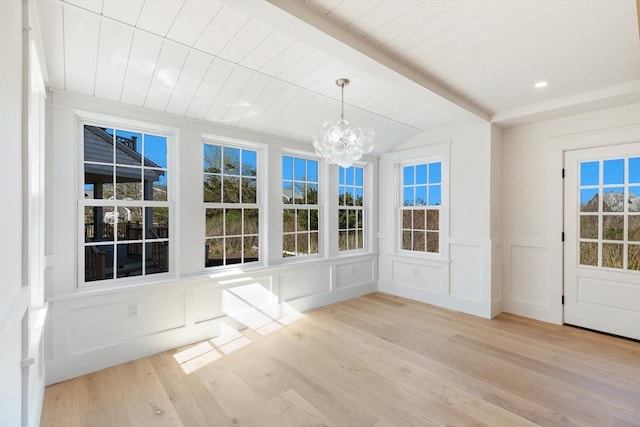 6 Mariner Way, Nantucket, MA 02564 - unfurnished dining area with lofted ceiling with beams, light wood finished floors, a decorative wall, and a chandelier