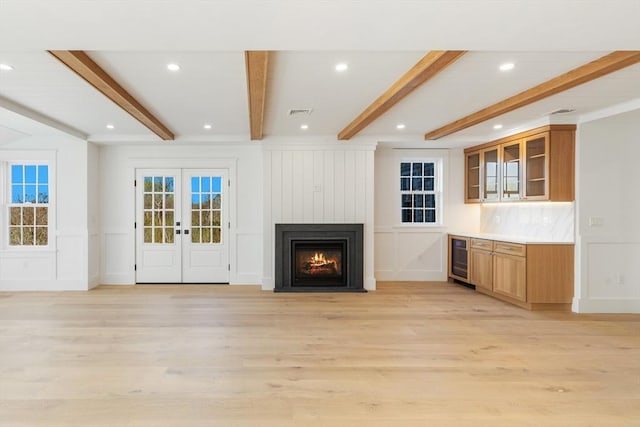 6 Mariner Way, Nantucket, MA 02564 - unfurnished living room featuring beamed ceiling, a decorative wall, and beverage cooler