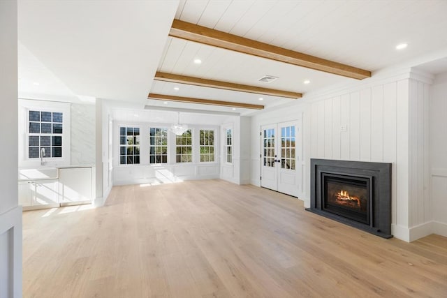 6 Mariner Way, Nantucket, MA 02564 - unfurnished living room featuring recessed lighting, light wood-style flooring, a glass covered fireplace, and beamed ceiling