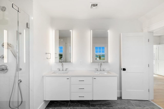 6 Mariner Way, Nantucket, MA 02564 - bathroom featuring visible vents, a sink, and a marble finish shower