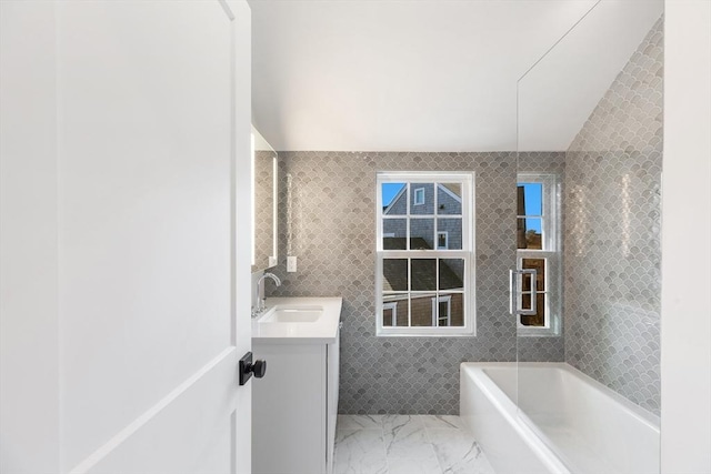 6 Mariner Way, Nantucket, MA 02564 - bathroom featuring vanity, marble finish floor, a tub, and tile walls