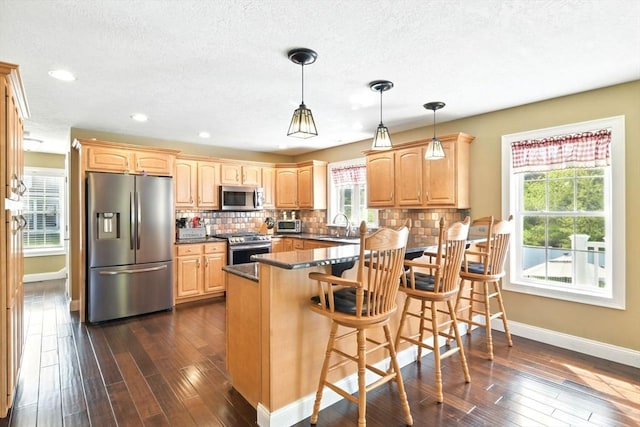 8 Pheasant Run, Belchertown, MA 01007 - kitchen featuring appliances with stainless steel finishes, baseboards, dark wood-style floors, tasteful backsplash, and a textured ceiling