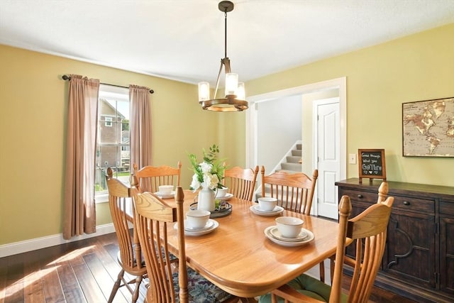 8 Pheasant Run, Belchertown, MA 01007 - dining space with a chandelier, dark wood-style flooring, baseboards, and stairway