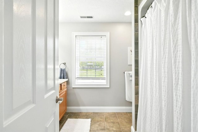 8 Pheasant Run, Belchertown, MA 01007 - full bathroom featuring baseboards, tile patterned floors, vanity, and curtained shower