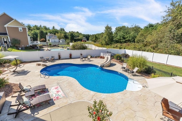 8 Pheasant Run, Belchertown, MA 01007 - view of swimming pool featuring a water slide, a patio area, and a fenced backyard