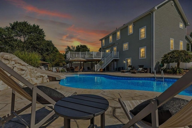 8 Pheasant Run, Belchertown, MA 01007 - pool at dusk with stairway, a water slide, a deck, a patio, and an outdoor pool