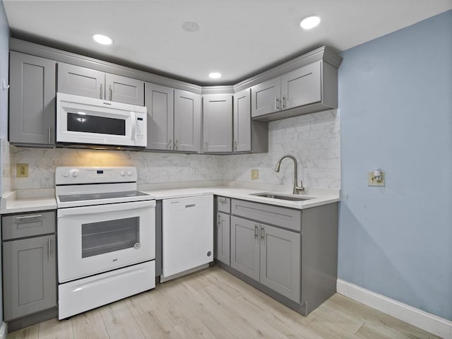 24 Bettys Pond Rd Unit K, Barnstable, MA 02601 - kitchen featuring white appliances, gray cabinets, a sink, backsplash, and recessed lighting