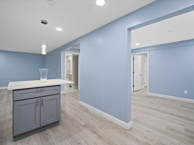24 Bettys Pond Rd Unit K, Barnstable, MA 02601 - kitchen with gray cabinetry, baseboards, light wood finished floors, decorative light fixtures, and recessed lighting