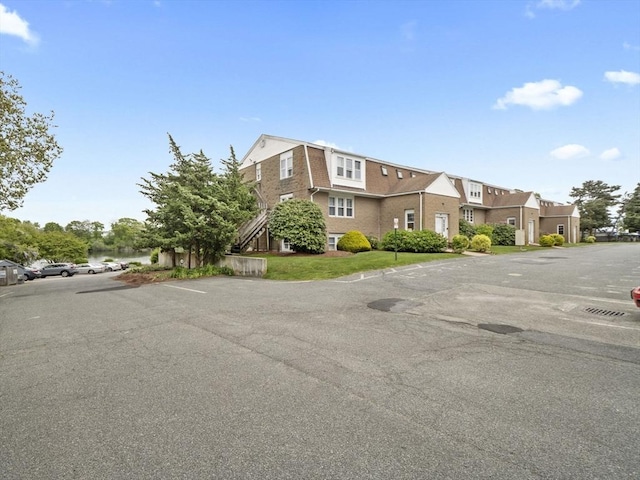 24 Bettys Pond Rd Unit K, Barnstable, MA 02601 - view of building exterior featuring uncovered parking