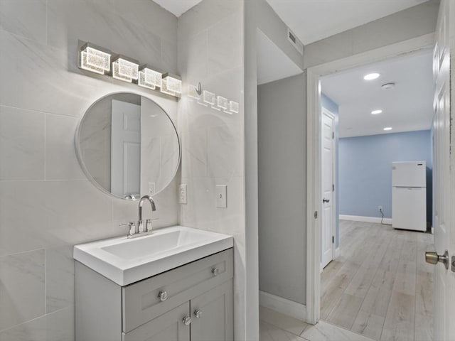 24 Bettys Pond Rd Unit K, Barnstable, MA 02601 - bathroom featuring vanity, baseboards, and recessed lighting