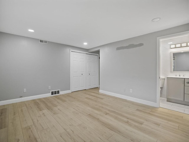 24 Bettys Pond Rd Unit K, Barnstable, MA 02601 - unfurnished bedroom featuring light wood-style floors, recessed lighting, baseboards, a closet, and connected bathroom