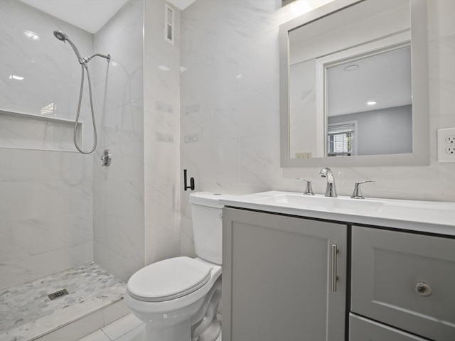 24 Bettys Pond Rd Unit K, Barnstable, MA 02601 - bathroom with toilet, vanity, a stall shower, and tile walls