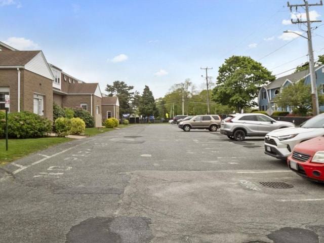 24 Bettys Pond Rd Unit K, Barnstable, MA 02601 - view of asphalt road with street lights and a residential view