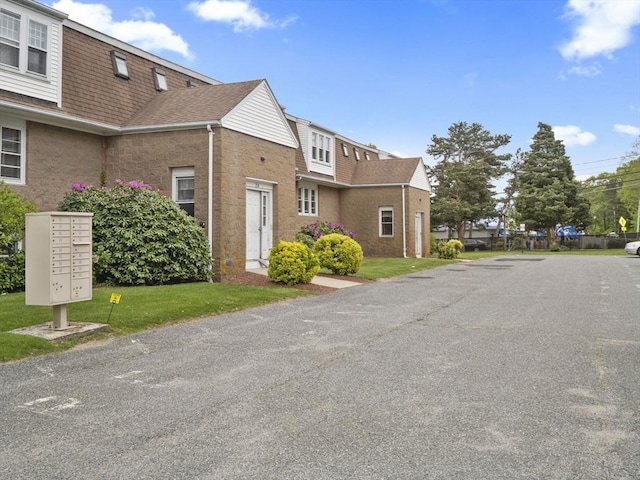 24 Bettys Pond Rd Unit K, Barnstable, MA 02601 - view of asphalt street with a residential view
