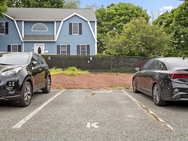 24 Bettys Pond Rd Unit K, Barnstable, MA 02601 - view of front of house with roof with shingles and uncovered parking