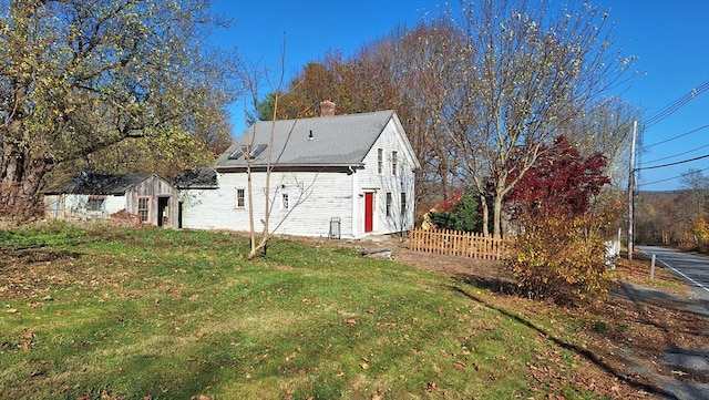 view of property exterior featuring a yard