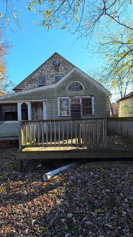 back of house with a wooden deck