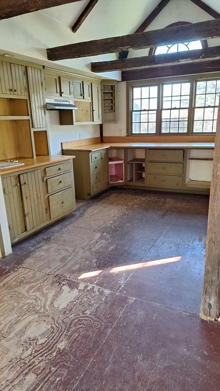 kitchen with vaulted ceiling with beams