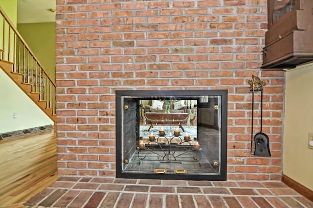 interior details featuring baseboards and a fireplace