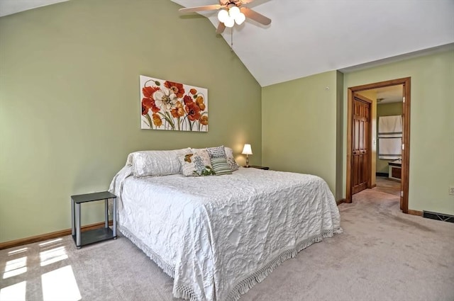bedroom with visible vents, baseboards, light colored carpet, and vaulted ceiling