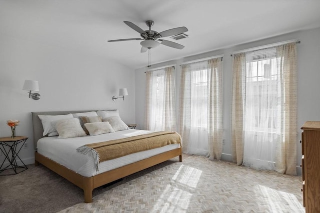 bedroom featuring visible vents and ceiling fan