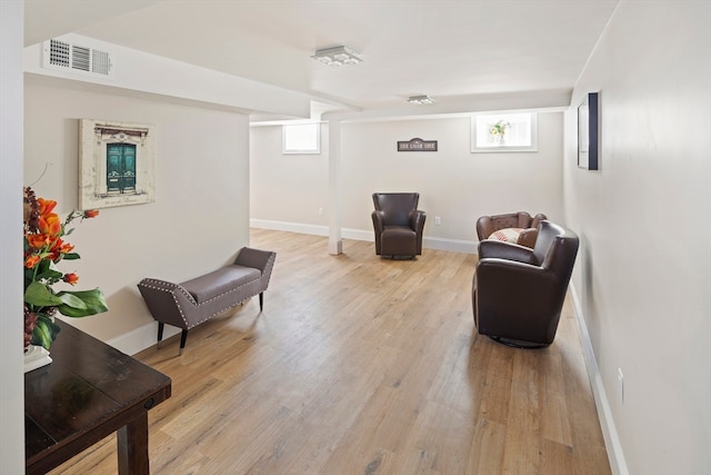 living area with light hardwood / wood-style floors