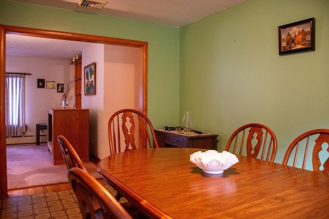 view of carpeted dining space