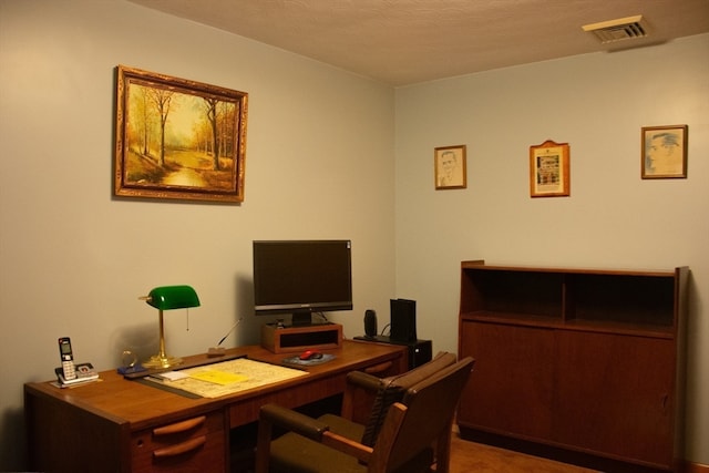 office space featuring a textured ceiling