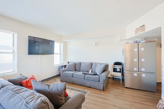 living room with light hardwood / wood-style floors