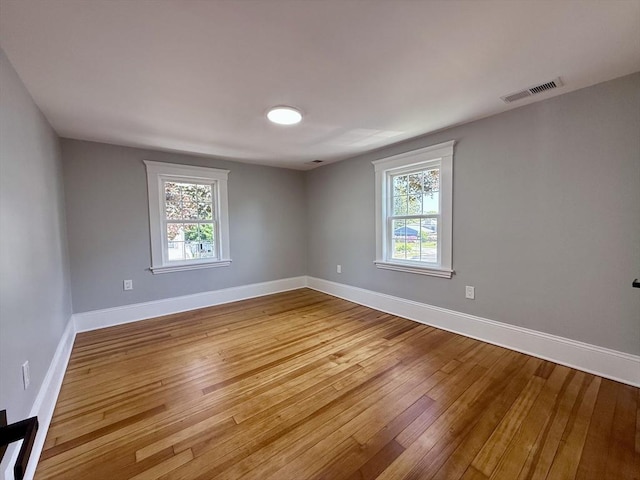 61 Poplar St, Danvers, MA 01923 - empty room with wood-type flooring and baseboards