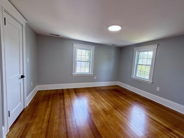 61 Poplar St, Danvers, MA 01923 - spare room featuring hardwood / wood-style floors, plenty of natural light, and baseboards